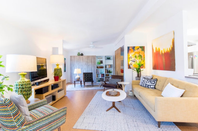 Eclectic Mid-Century Living Room with Vibrant Abstract Art