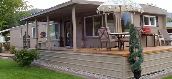 Elevated Wooden Deck: Manufactured Home, Fringed Patio Umbrella