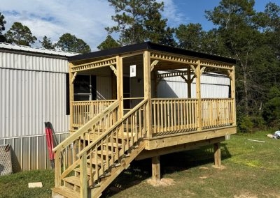 Elevated Wooden Porch with Covered Roof and Side Stairs