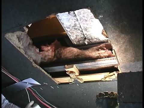 Exposed Ductwork View through Ceiling Cutout with Pink Insulation