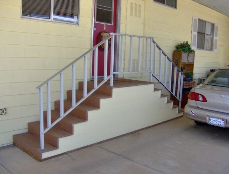 Exterior Stairs with Silver Handrails, Wood Toned Composite.