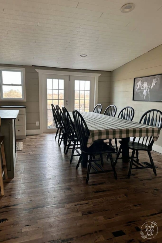 Farmhouse Dining Room with Windsor Chairs and Wide Plank Hardwood Floors