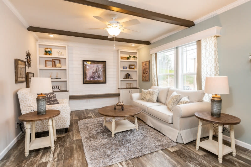 Farmhouse Family Room with Dark Wood Beams and Shiplap Built-ins