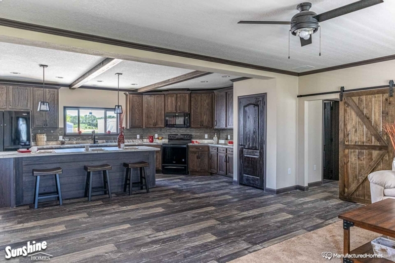 Farmhouse Kitchen with Planked Island Design and Barn Door