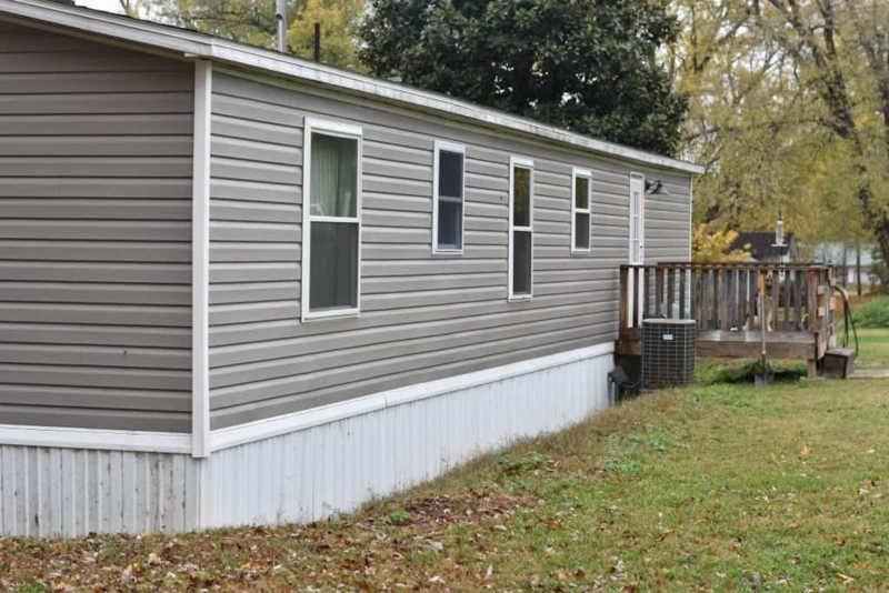 Farmhouse Style Double Wide with Grey Siding & White Skirting