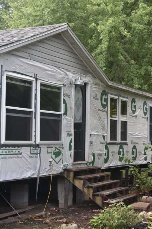 Farmhouse Style House Siding Renovation Prep with Gooseneck Lighting