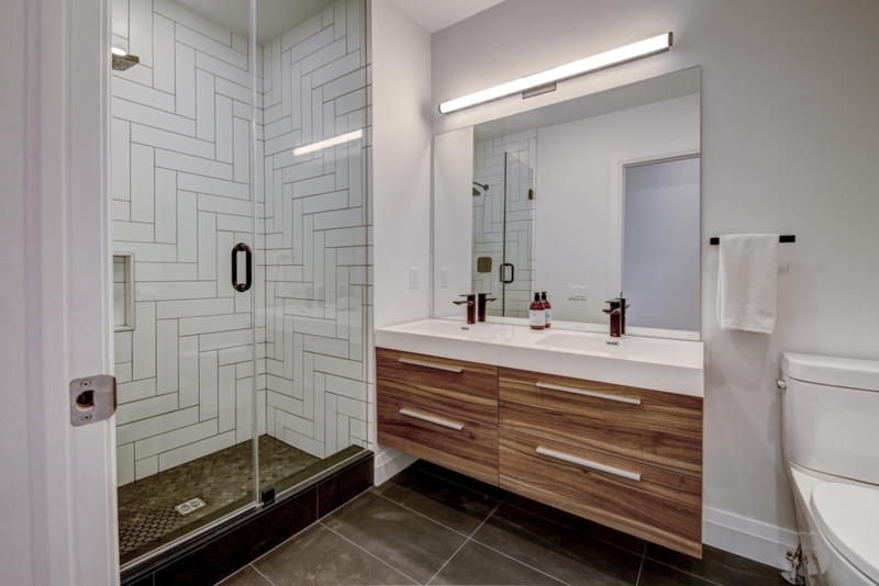 Floating Vanity Bathroom with White Herringbone Shower Tile