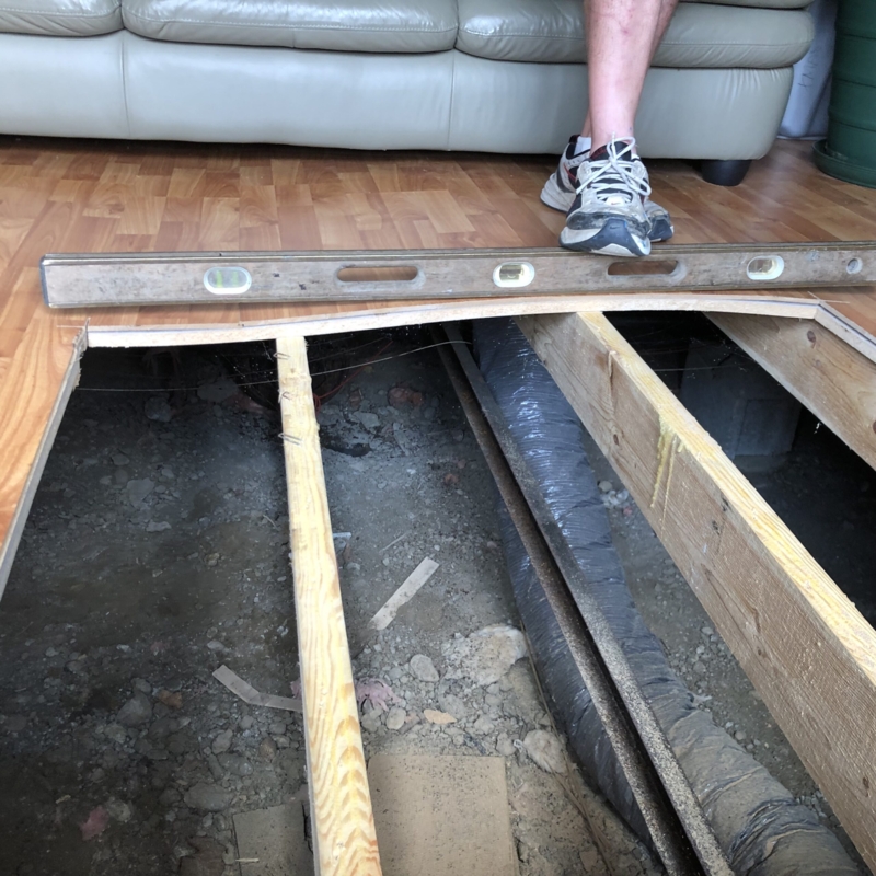 Floor Leveling Repair Scene Exposed Joists With Spirit Level Tool