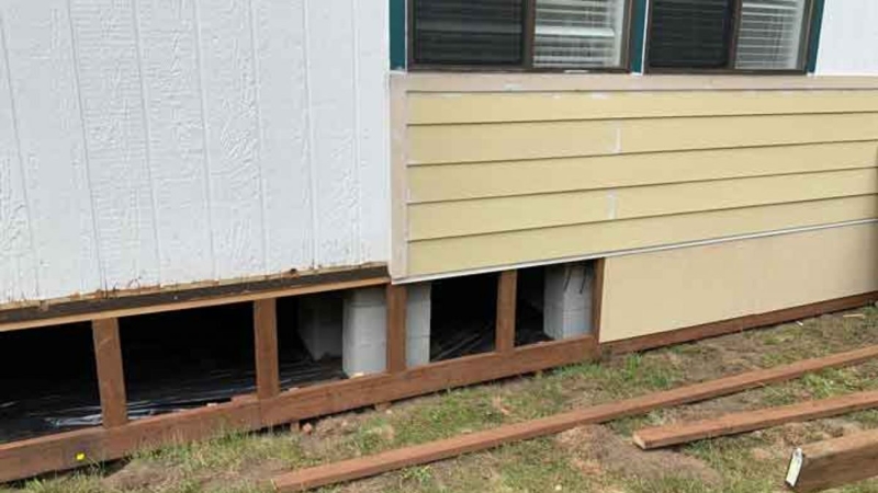 Foundation Skirting Frame: Exposed Wood Framing on Concrete Piers
