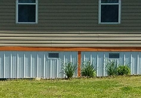 Foundation Skirting: White Ribbed Metal with Integrated Vents
