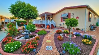 Front Yard Garden with Tiered Blue Fountain & Curved Landscape Beds