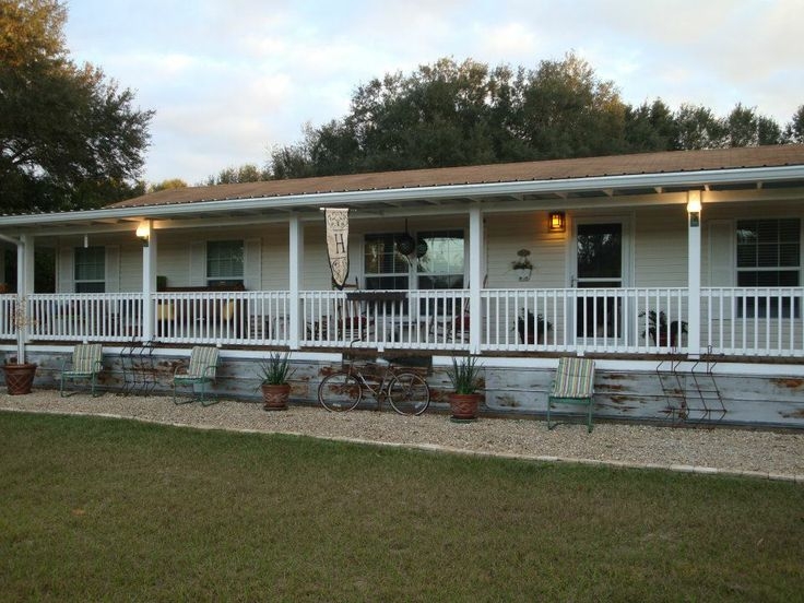 Full Length Front Porch with White Spindle Railing & Gravel