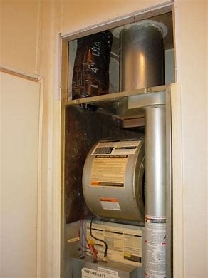 Furnace Unit installed in Utility Closet with Vertical Venting
