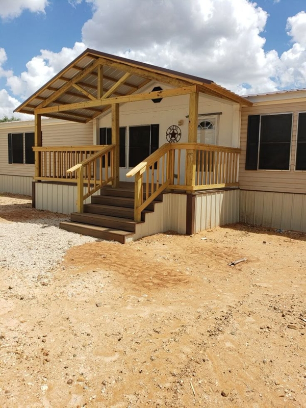 Gabled Roof Porch With Wooden Baluster Railing | Rustic Manufactured Home