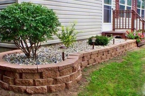 Garden Landscaping: Tiered Stone Retaining Wall & Gravel Mulch