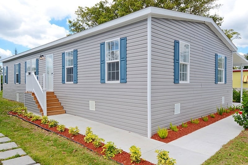 Gray Vinyl Siding with Blue Shutters: Mobile Home Exterior Makeover