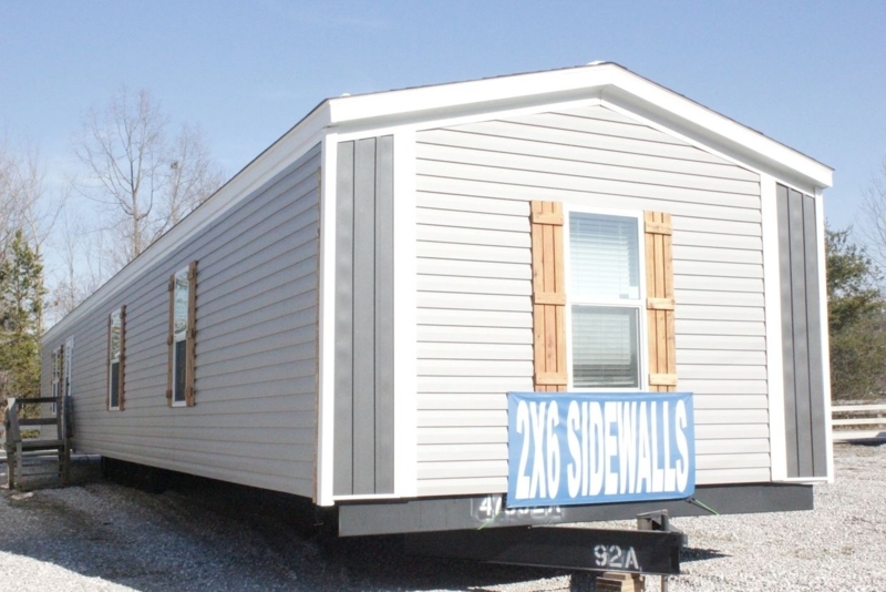 Grey Manufactured Home Exterior with Wood Toned Shutters