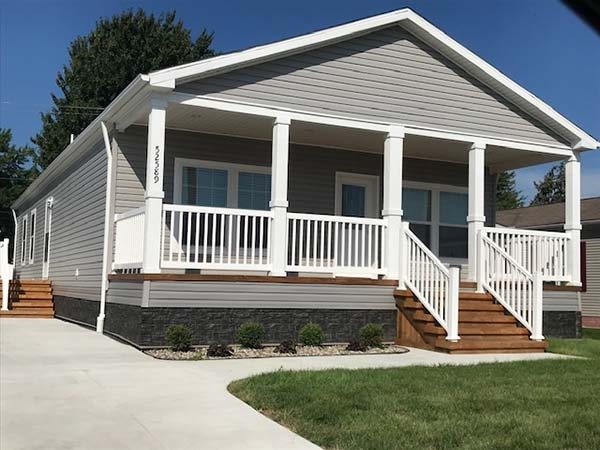 Grey Mobile Home Siding featuring a spacious Covered Front Porch