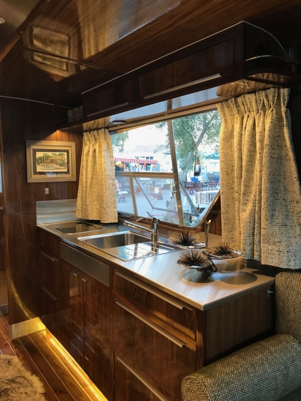 High Gloss Wood Paneling Kitchenette with Stainless Steel Counter