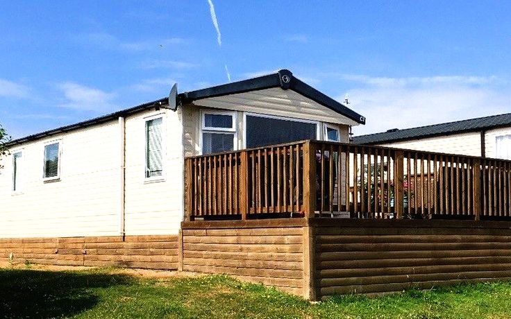 Horizontal Wood Panel Skirting Matched with Large Wooden Deck