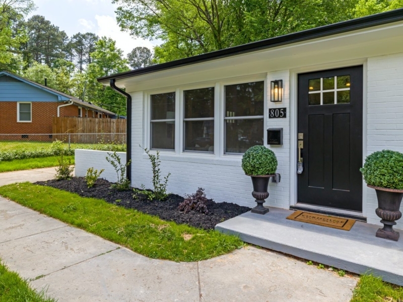 House Exterior Entryway: White Brick & Black Front Door