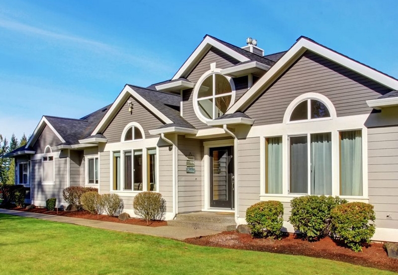 House Modern Craftsman Gray Siding Circular Gable Window Feature