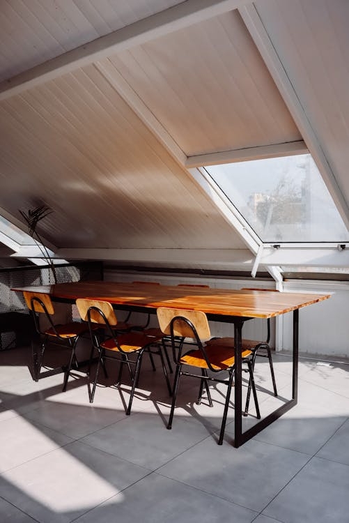 Industrial Modern Dining Table with Wood and Metal in Attic Placement