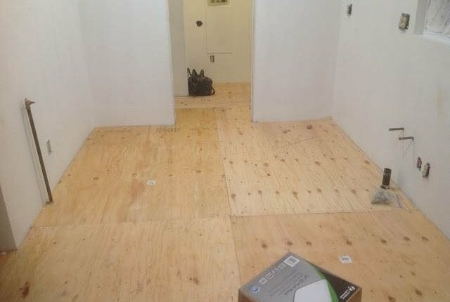 Installing Plywood Subfloor: Mobile Home Renovation with Exposed Utilities