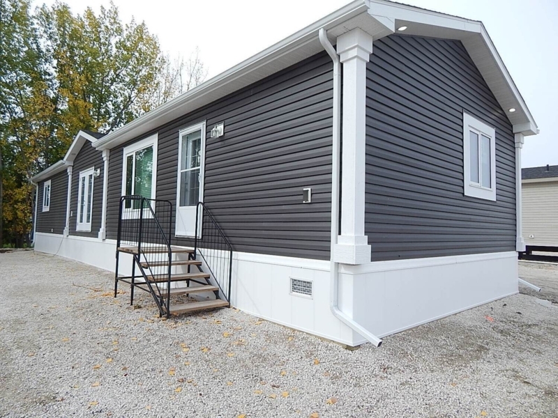 Insulated Skirting White Vinyl Panels Against Charcoal Grey Siding