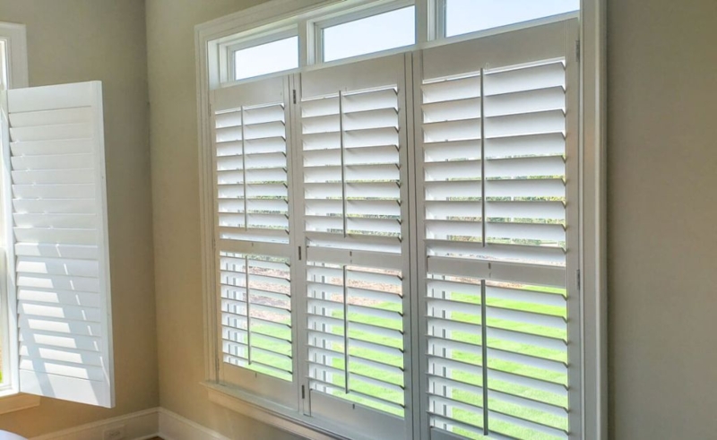 Interior Shutters with Hinged Panels and Adjustable Louvers