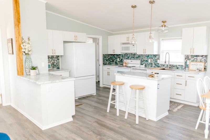 Kitchen Cabinets with Gold Hardware & Teal Backsplash