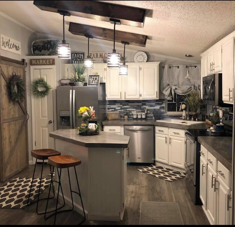 Kitchen Renovation with Dark Ceiling Beams and Sliding Barn Door