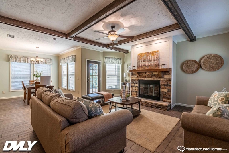 Living Room with Exposed Beams and Stacked Stone Fireplace.