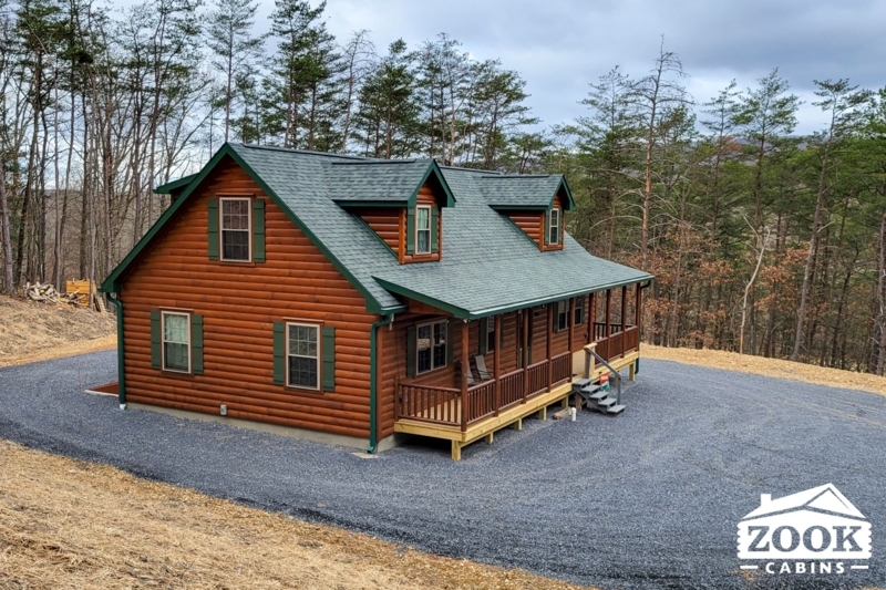 Log Cabin with Dormer Windows and Forest Green Roof