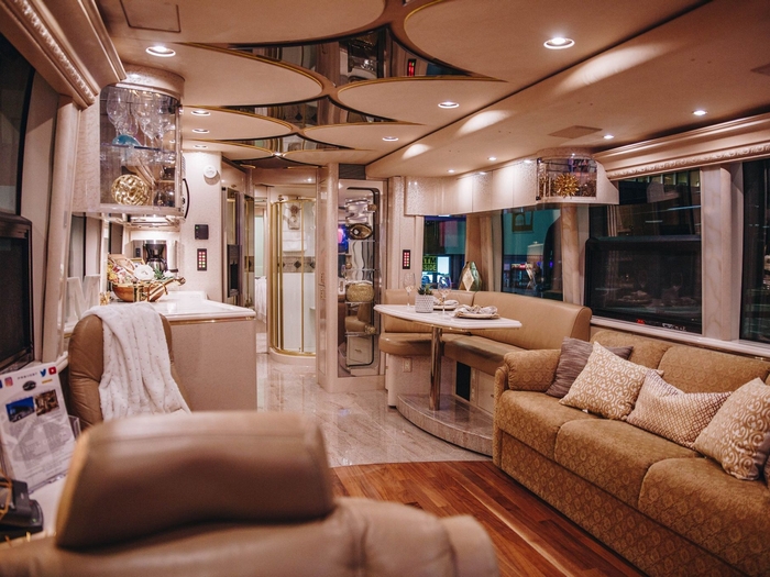 Luxury RV Living Room Layout with Mirrored Ceiling and Recessed Lighting