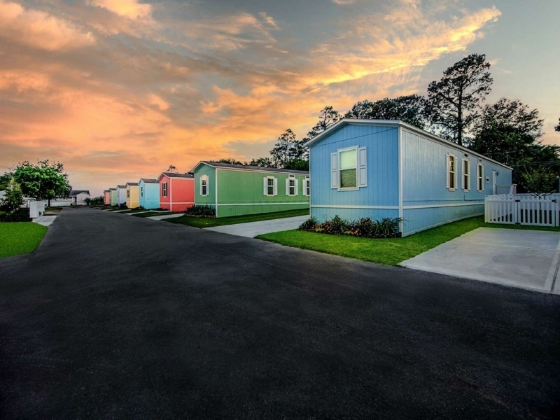Manufactured Home Community Suburban Layout with Pastel Colors at Sunset