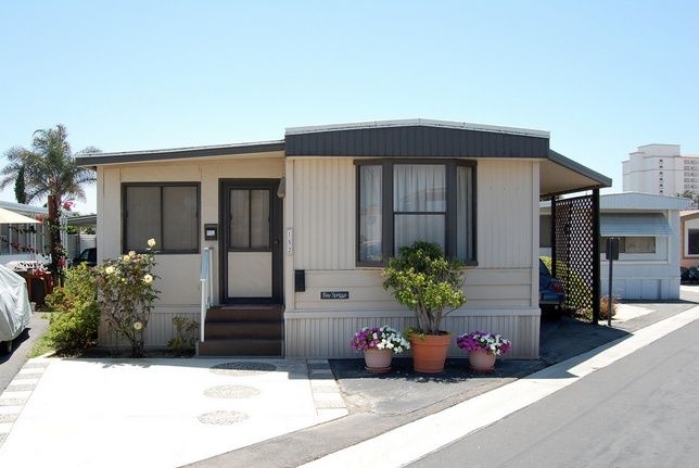 Manufactured Home Exterior featuring Bay Window and Carport Lattice Design