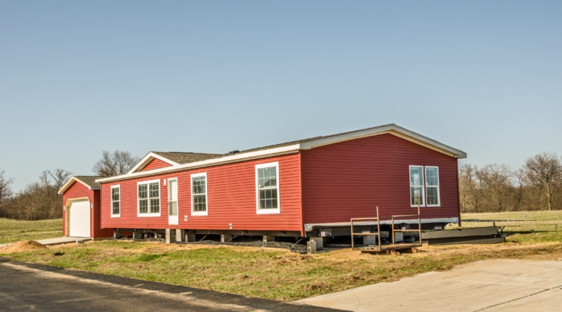 Manufactured Home Red Siding White Framed Windows Ranch Style