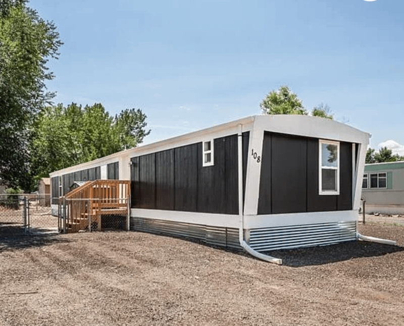 Manufactured Home Remodel: Black Vertical Siding & Metal Skirting