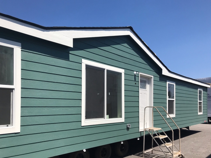 Manufactured Home Teal Siding Gabled Entryway White Trim Contrast