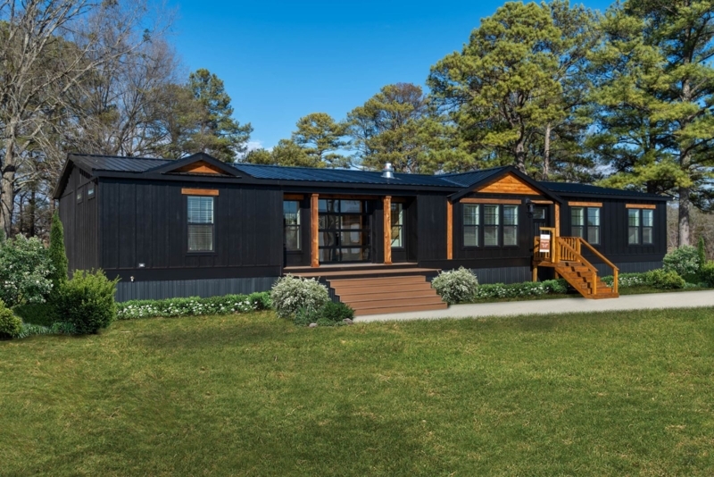 Manufactured Home with Black Exterior and Wood Accents.
