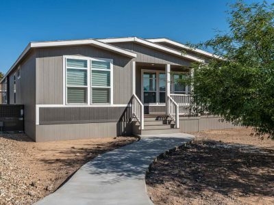 Manufactured Home with Curved Concrete Walkway & Recessed Porch