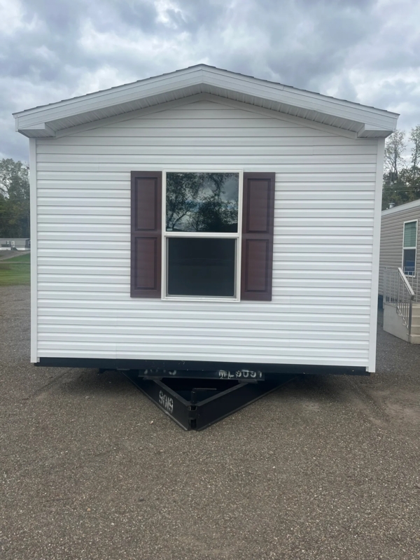 Manufactured Home with Dark Brown Shutters and White Siding