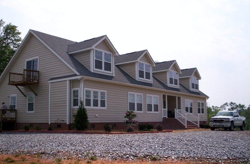 Manufactured Home with Four Dormer Windows & Brick Foundation