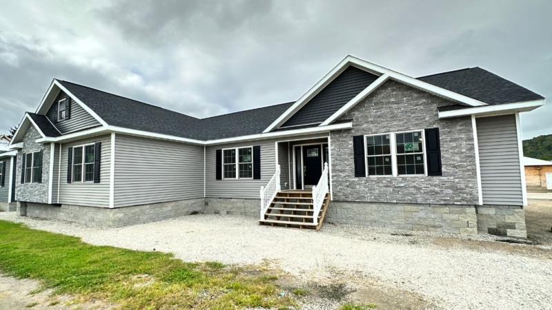 Manufactured Home with Multi-Peak Roofline & Grey Siding Design