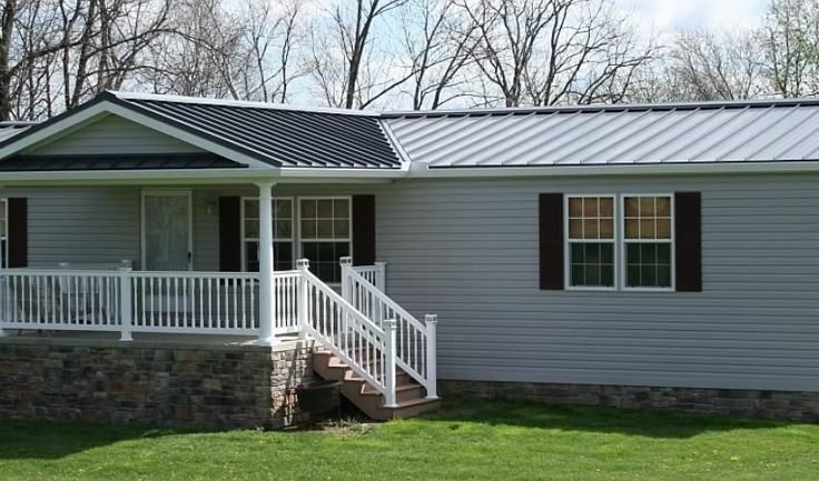 Manufactured Home with Standing Seam Roof and Stone Skirting