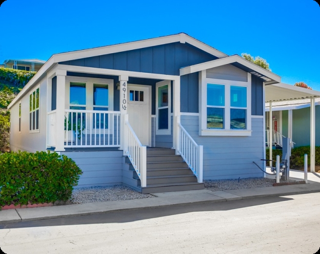 Manufactured Home with Two-Tone Blue Siding and Thick White Columns