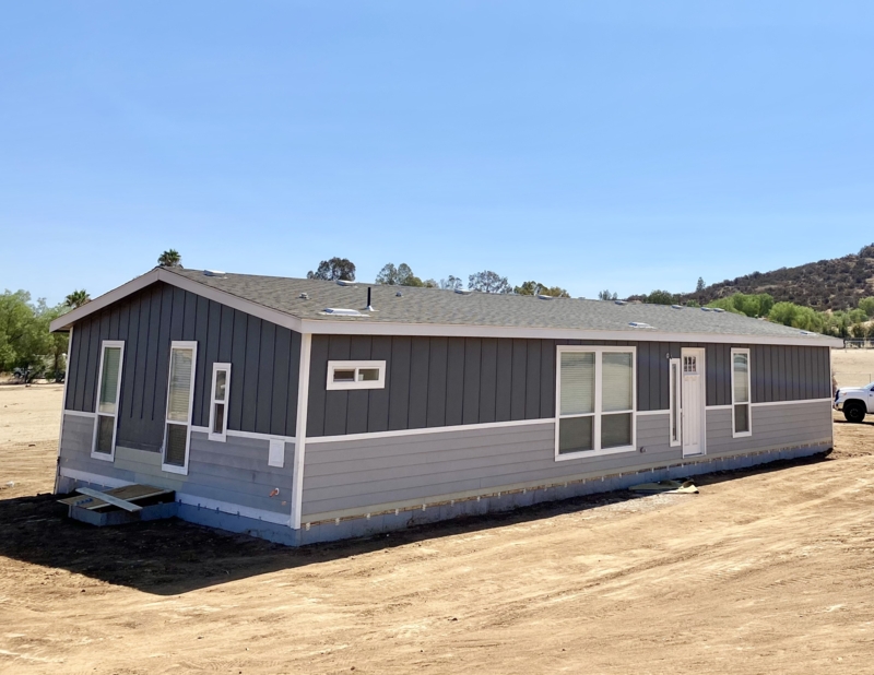 Manufactured Home with Two-Tone Exterior and Vertical Siding