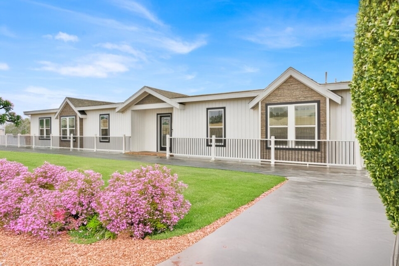 Manufactured Home with White Siding, Black Trim & Stone Gable Accents