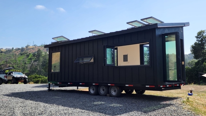 Matte Black Tiny Home: Multiple Roof Skylights, Large Windows